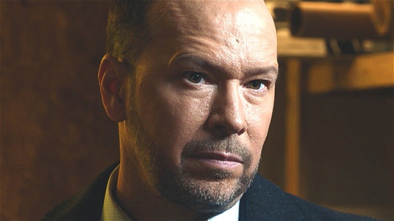 Danny Reagan smirking