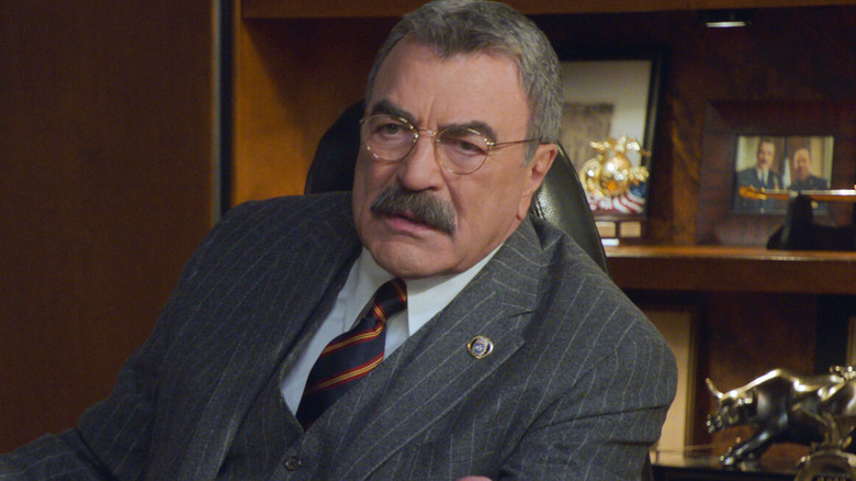 Frank Reagan at his desk