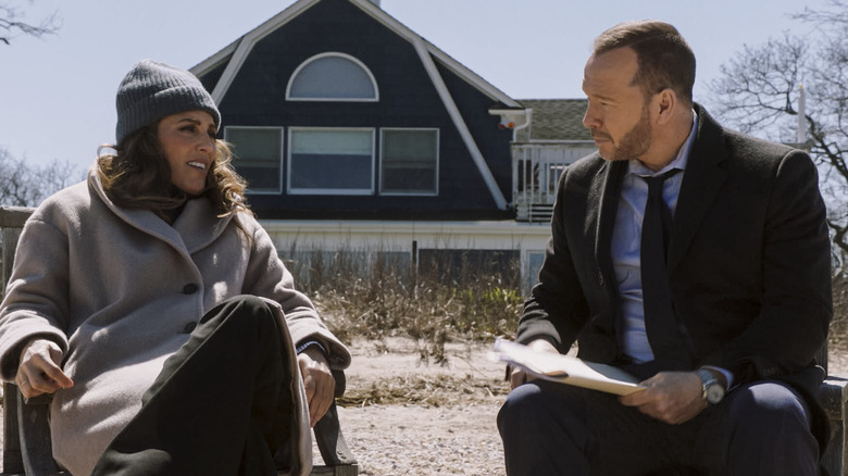 Jackie and Danny sitting in front of a barn