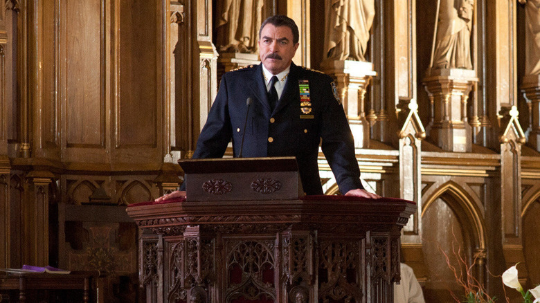 Frank gives a speech at a pulpit in "Blue Bloods"