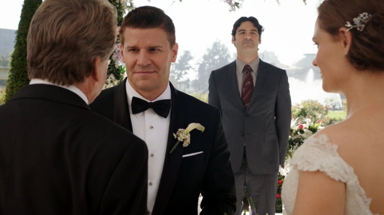 Booth talks with Bones' father during the wedding 