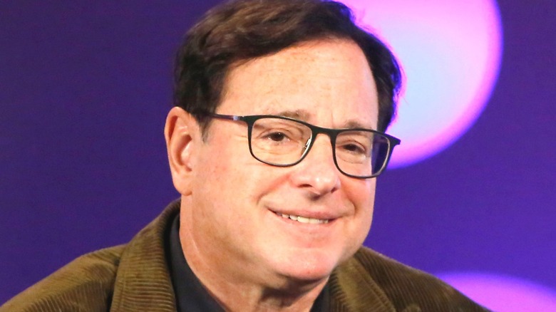 Bob Saget with glasses smiling at event