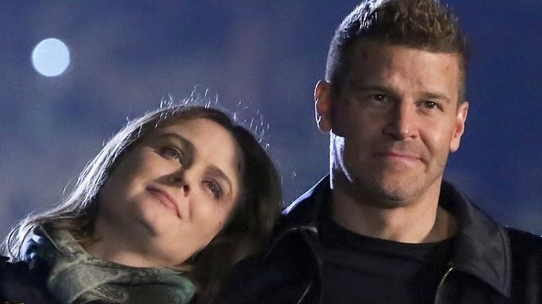 Brennan rests her head on Booth's shoulder in "Bones" (2017)