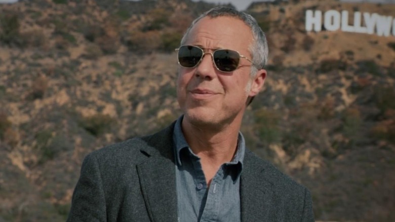 Bosch looks into the sun in front of the Hollywood sign in "Bosch" (2014-2021)