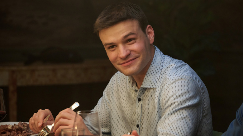 Sean Reagan smiling at dinner in 