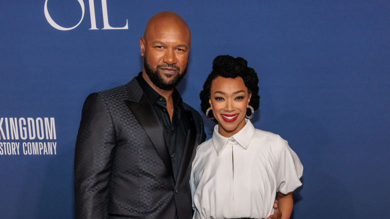 Sonequa Martin-Green and Kenric Green smile on the red carpet