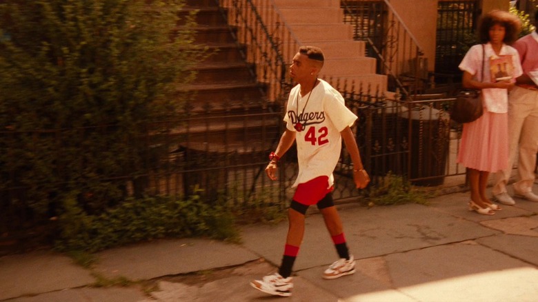 Mookie walking down the street in Do the Right Thing (1989)