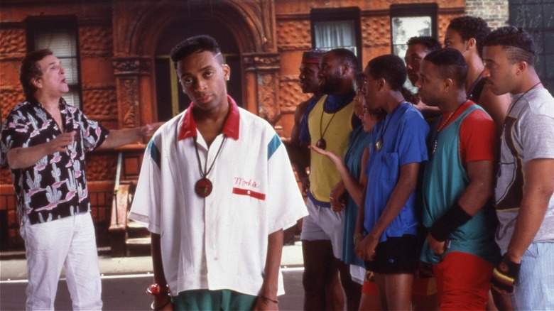 Mookie standing in front of Sal as he argues with the neighborhood guys