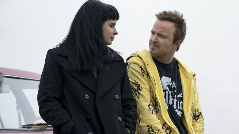 Jane and Jesse sitting on car