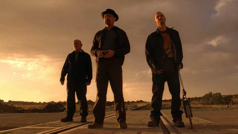 Mike, Walter, and Jesse prepare to rob a train