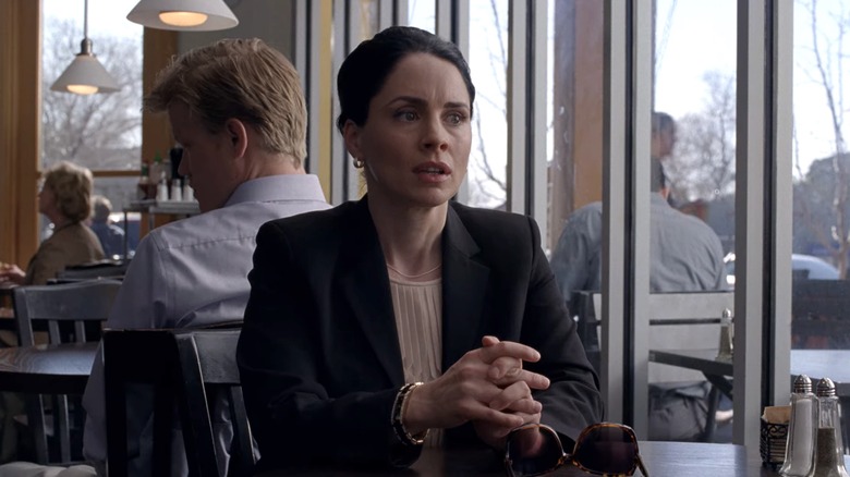 Lydia sits at table 