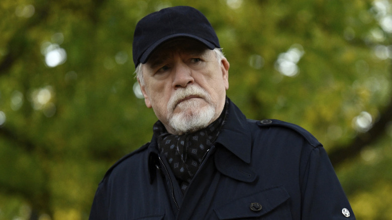 Logan in black hat outside