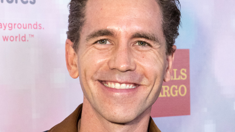 Brian Dietzen smiling at event