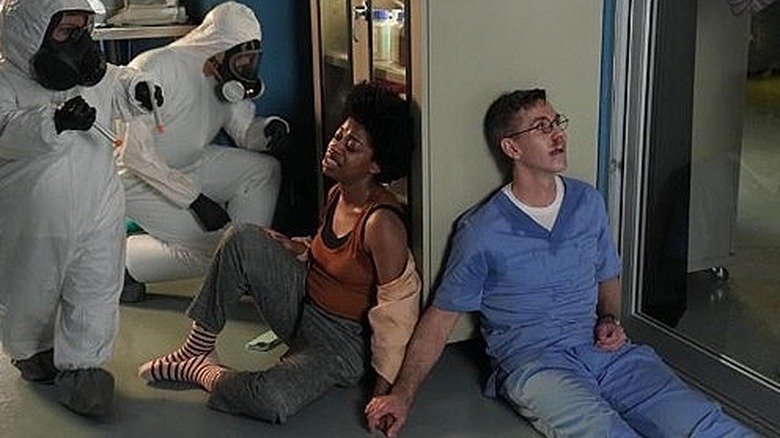 Diona Reasoner and Brian Dietzen sitting 