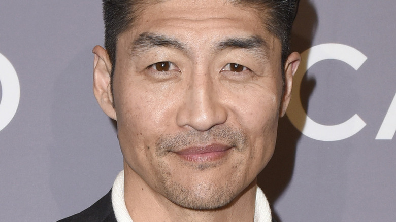 Brian Tee smirking