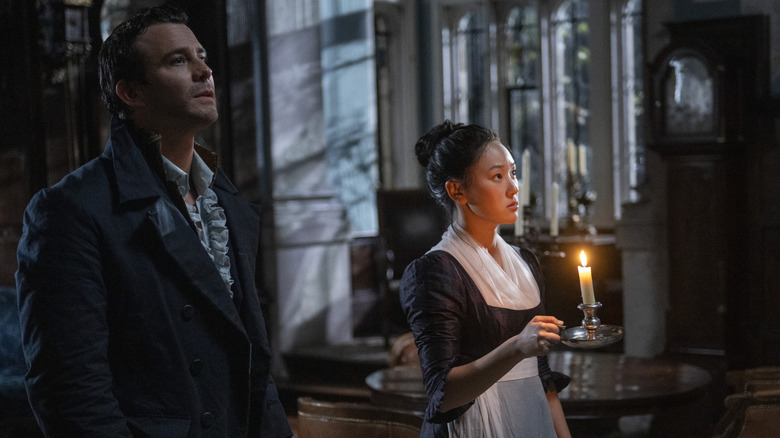 Benedict and Sophie walk through manor at night