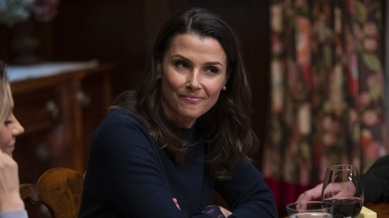 Bridget Moynahan sitting at the dinner table