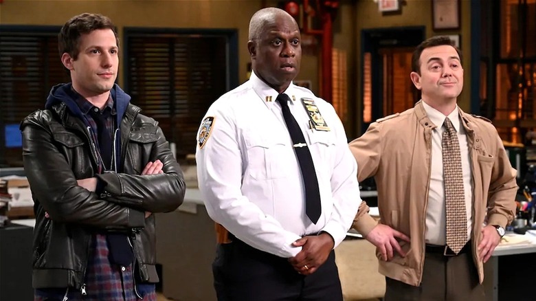 Holt talking while Boyle and Peralta flank him (Season 6, Episode 18)
