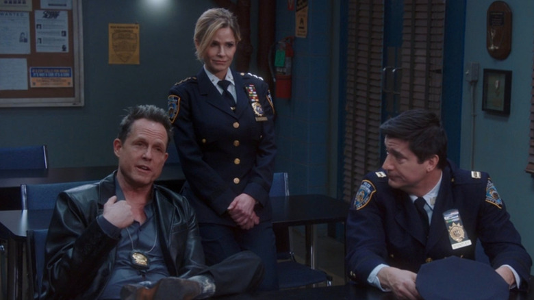 The Vulture, Madeline Wuntch, and Captain CJ, sitting in the 99th precinct break room.