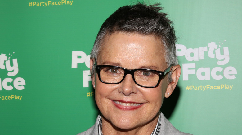 Amanda Bearse wearing glasses smiling