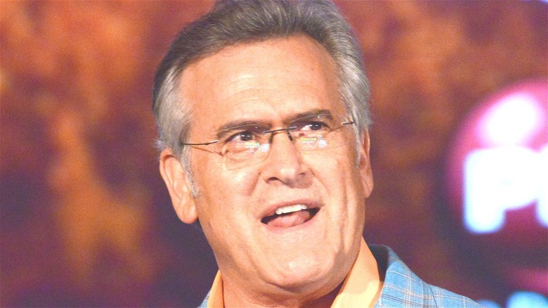 Bruce Campbell wearing glasses