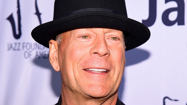 Bruce Willis smiling for cameras
