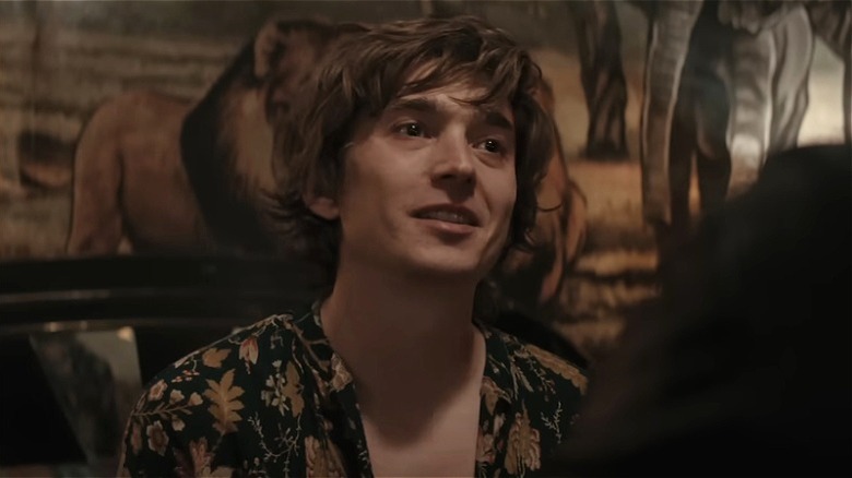 Kid talking to his two hitmen "friends" in Wolfs (2024)