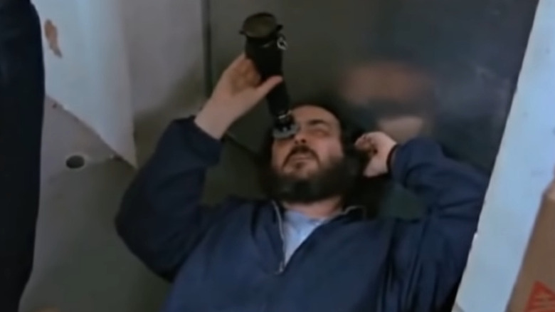 Stanley Kubrick looking up through viewfinder