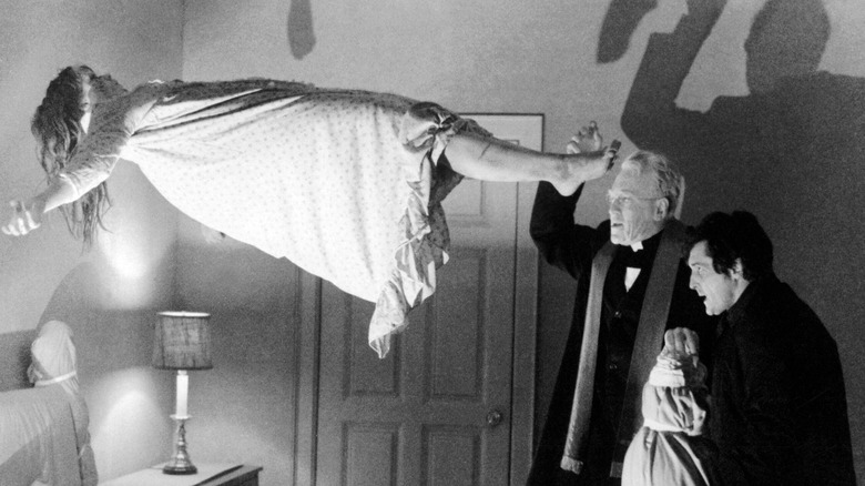 Possessed Regan and priests in The Exorcist