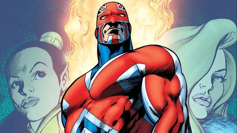 Captain Britain standing in front of flames flanked by two women