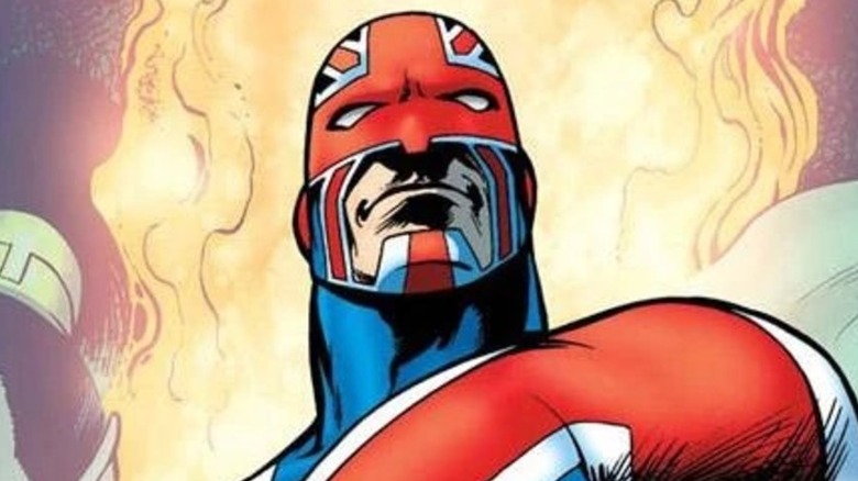 Captain Britain standing in front of flames