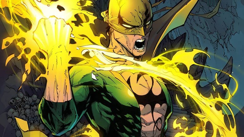 Iron Fist holding up his glowing fist on the cover of "Iron Fist: Heart of the Dragon" Volume 1