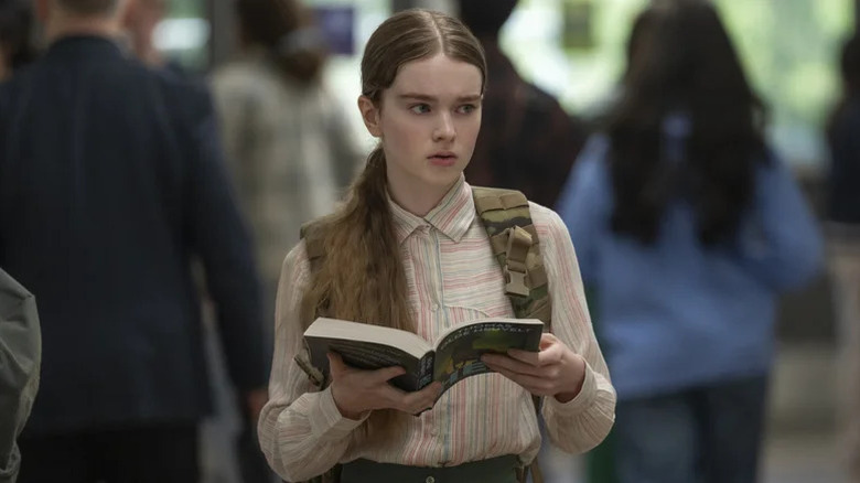 Carrie White looking concerned and holding a book in "Carrie" (2026)