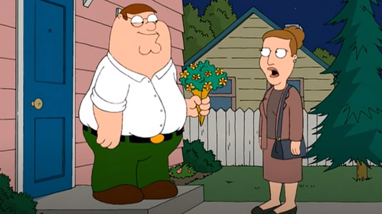 Peter giving Angela flowers