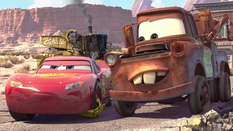Lightning McQueen and Mater standing next to each other in 