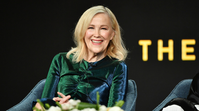 Catherine O'Hara laughing in a green shirt