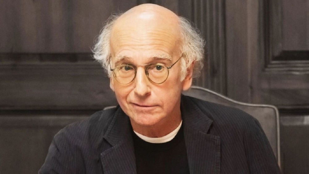 Larry David smirking