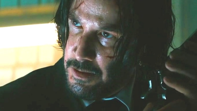 John Wick holding gun