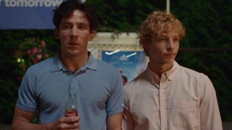 Art and Patrick standing outside at a party in 