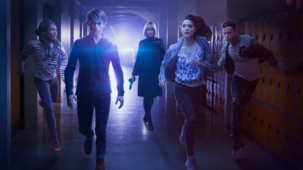 The cast of Doctor Who spin-off Class running down a school hall