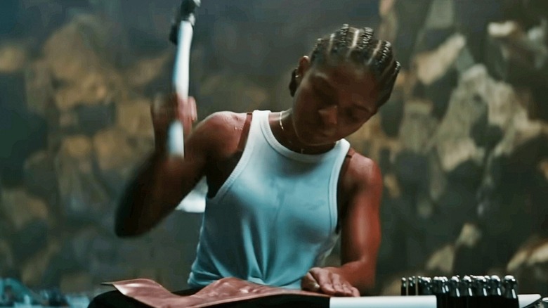 Riri Williams forging power suit