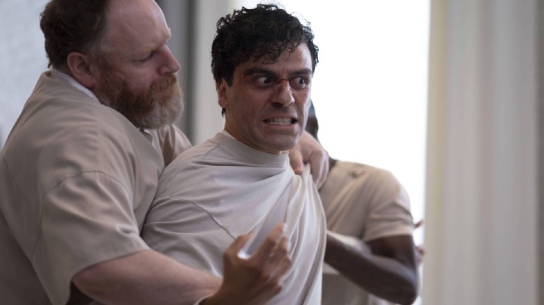 Marc being restrained