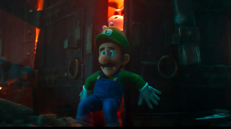 Luigi pressed against an opening door in fear 