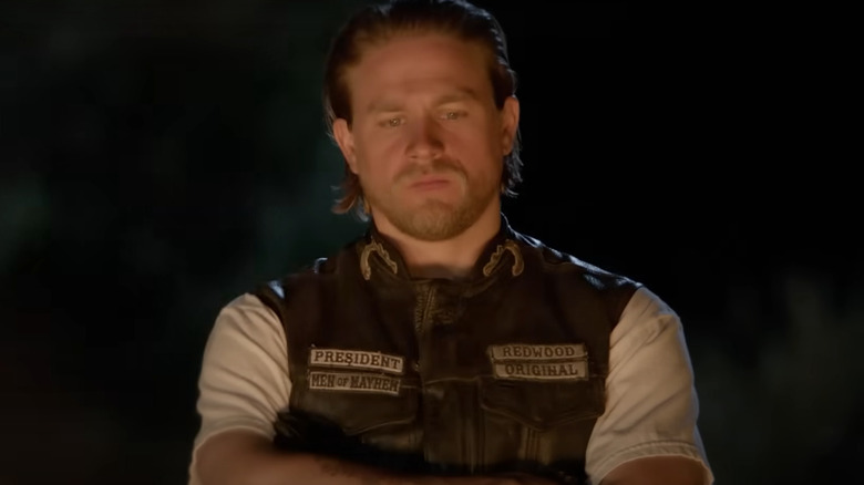 Jax from Sons of Anarchy looking at fire