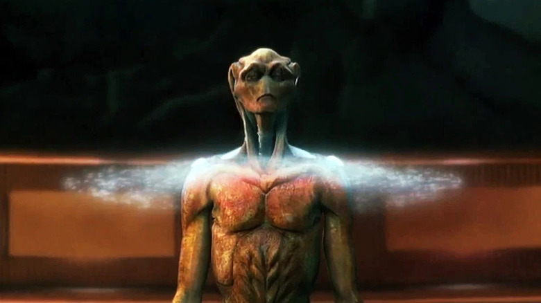 An alien standing in a ring of light in The Arrival