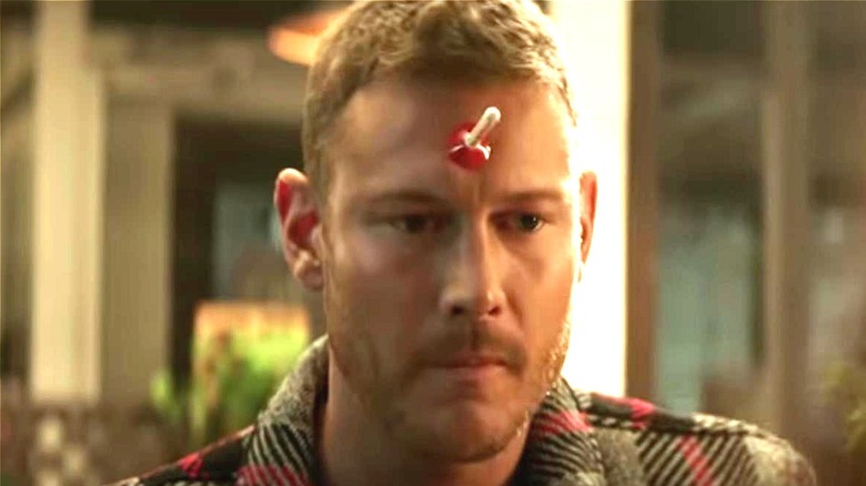 Tom Hopper with dart on forehead