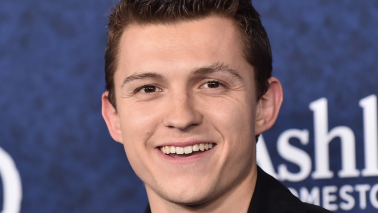 Tom Holland smiling red carpet