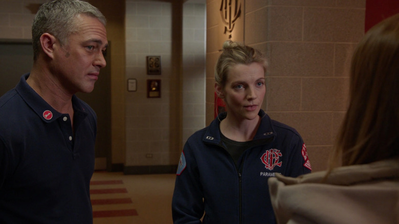 Brett and Severide talking to woman