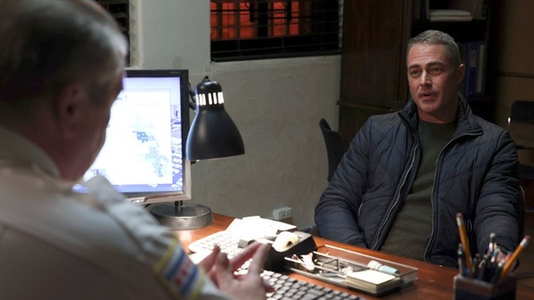 Kelly Severide seated in an office