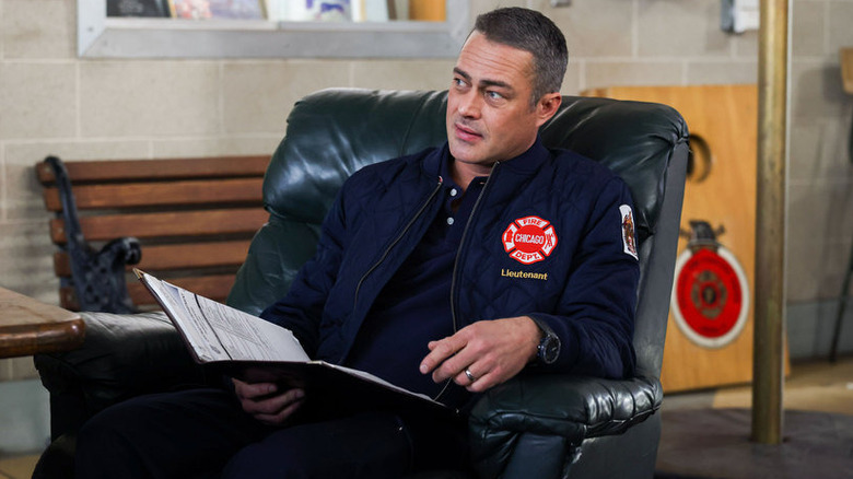 Severide sitting in chair